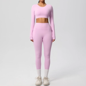 Front view of light pink long sleeve crop top and high waist yoga leggings set