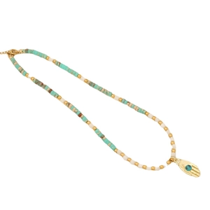 Bohemian beaded necklace with turquoise stones and golden Hamsa hand evil eye pendant