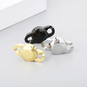 Close-up of stainless steel chain connectors in gold, silver, and black for DIY jewelry