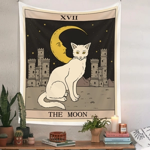 Detail of The Moon tarot tapestry with white cat hung over a wooden side table