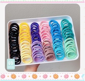 Colorful high-elastic seamless hair ties neatly arranged in a tray for variety