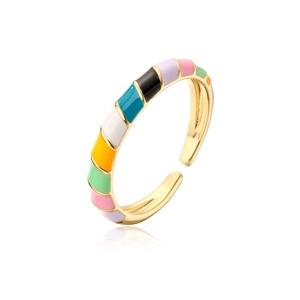 Macro shot of gold plated adjustable ring with vibrant rainbow enamel geometric sections