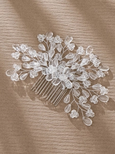 Detailed view of handcrafted crystal beads and pearls on a silver bridal hair comb