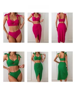 Three-piece bikini set detail showing emerald green and rose pink swimsuits with skirt