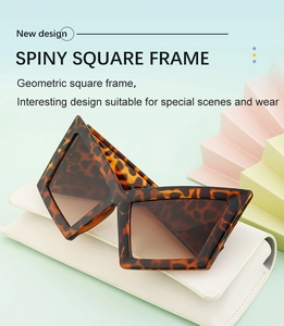 Detail view of leopard print geometric sunglasses on a premium leather case