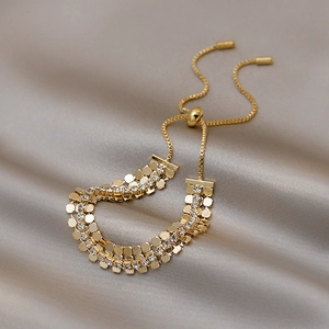 Bracciale dorato geometrico vintage con doppia fila di strass su seta champagne