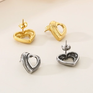 Minimalist 18K gold and vintage silver hollow heart stud earrings in stainless steel