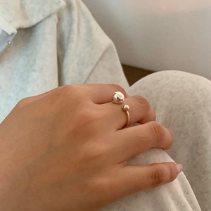 Detail of adjustable S925 sterling silver ring with two polished minimalist sphere beads