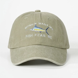 Close-up of Fish Fear Me embroidery and sailfish detail on washed olive baseball cap
