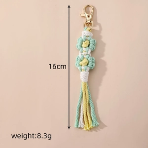 Handmade woven daisy flower keychain in mint green and yellow for bags and keys