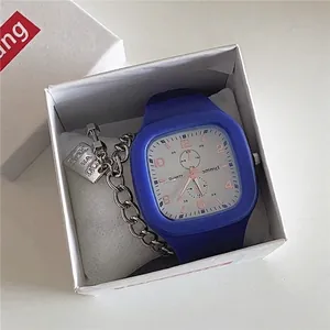 Close-up of blue square kids watch with silver dial and matching chain bracelet in box