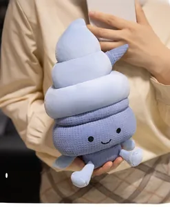 Detailed view of blue plush ice cream pillow with embroidered face and soft texture