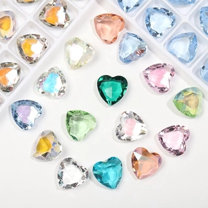 Detailed view of 12mm faceted heart-shaped glass crystals in various vibrant colors