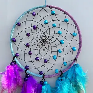 Bohemian purple and blue dream catcher wall hanging with feathers and beadwork details