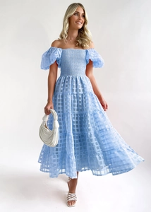 Detail of light blue off-shoulder dress featuring ruched chest and puff sleeves texture
