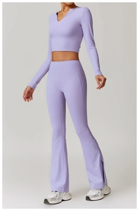 Detail of lavender yoga set featuring V-neck cropped top and flared pants with side slits
