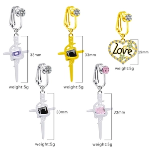 Detailed view of cross and heart non-piercing belly rings with cubic zirconia stones