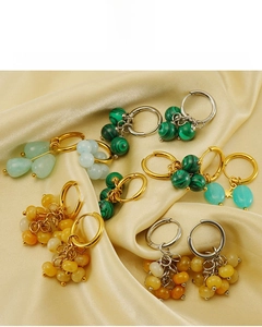 Detail of 18k gold plated stainless steel hoops featuring natural malachite stone texture