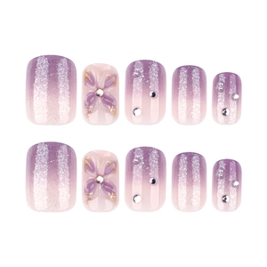 Short square purple gradient press-on nails with 3D bows and rhinestones on white background