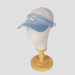 Denim open-top sun visor hat with embroidered C logo on a light grey background