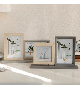 Detail view of 4x6 inch Nordic wooden picture frame with thick base on a desktop