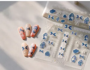 5D embossed nail stickers featuring blue bows, white lace, and pearl details on display nails