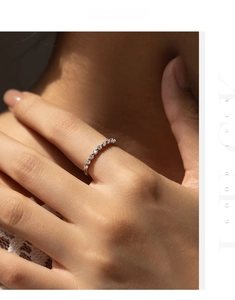 Detailed view of an elegant S925 sterling silver eternity band with moissanite stones