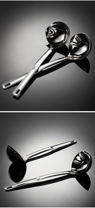 Macro detail of stainless steel oil separator ladle with side spout and polished finish