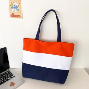Three-color striped canvas tote bag with orange, white, and deep blue horizontal patterns