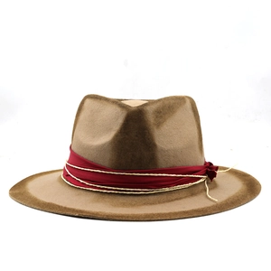 Detail of wool fedora hat with red satin band and gold braided rope accents