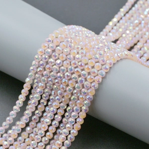 Macro shot of 4mm faceted light pink glass beads with AB coating for DIY jewelry