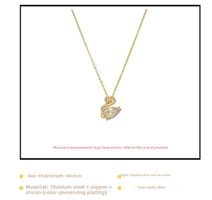 Close-up of golden swan pendant with zircon crystals on a 40cm titanium steel chain