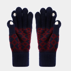 Detail of navy knit gloves with red argyle pattern and finger openings for touchscreens