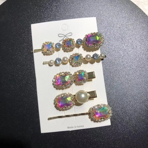 Detailed set of five vintage emerald rhinestone hair clips with pearls and crystals