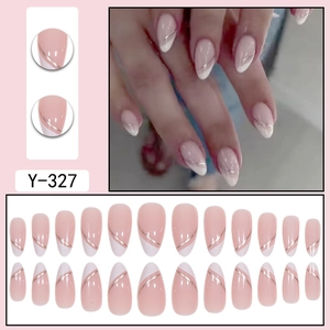 French almond press-on nails in nude and white with elegant gold line accents