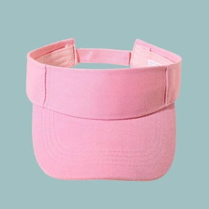 Detail of pink visor cap showing fine stitching and internal wash label for quality