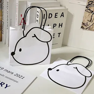 Minimalist white paper gift bag with cute cartoon dog print and durable rope handles