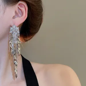 Silver needle tassel earrings with zircon leaf design for a vintage and elegant look