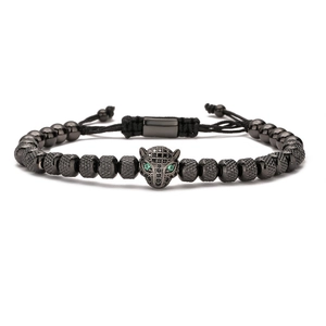 Men's black beaded leopard head bracelet with green eyes and adjustable woven cord