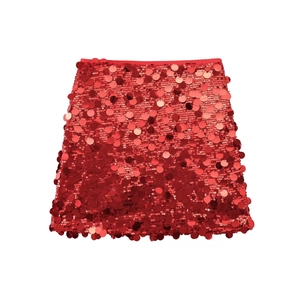 Detailed view of layered red sequins on a festive A-line mini skirt with metallic luster
