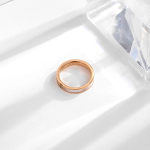 Rose gold titanium steel ring with white shell inlay and a sparkling diamond accent