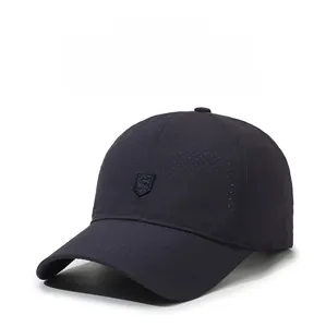 Close-up of breathable mesh fabric and embroidered S shield logo on navy baseball cap