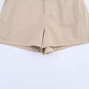 Detailed view of khaki cotton twill shorts showing hem stitching and crotch seam quality