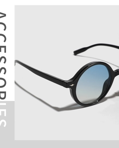 Detail of vintage oversized round sunglasses with blue gradient lenses and silver hardware