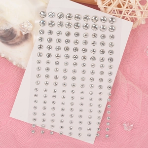 Self-adhesive butterfly crystal face gems and rhinestones on decorative mesh background
