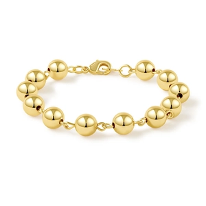 Minimalist gold plated lucky bead bracelet with polished metal spheres and lobster clasp
