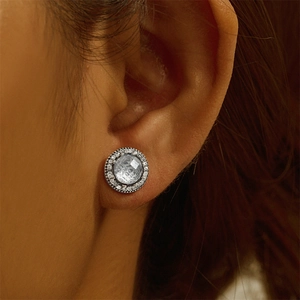 Macro shot of vintage S925 silver stud earring with grey zircon and pavé diamonds