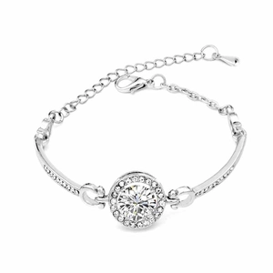 Fashion silver bracelet featuring a large round zircon center stone and halo of pave diamonds