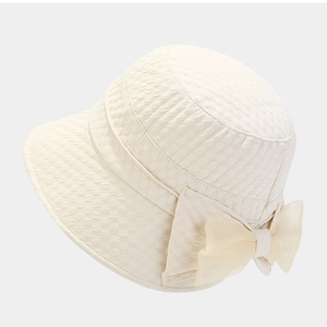 Women's foldable sun bucket hat with relief bubble texture and organza bow in beige color