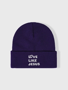 Detailed close-up of purple ribbed beanie with white Love Like Jesus embroidery